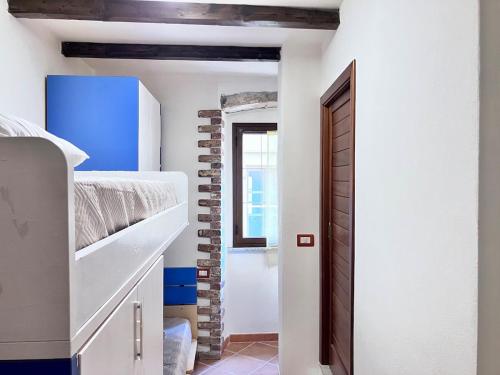 Ένα ή περισσότερα κρεβάτια σε δωμάτιο στο Spiaggia e borgo - la tua casa a Castelsardo