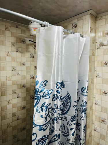 a shower curtain with a blue and white pattern at Bogotá Kings 302A in Bogotá