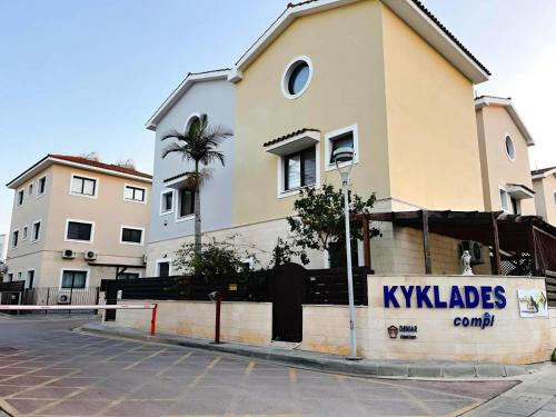 a building with a sign in front of it at Déjà Blue Apartment Kyklades BC7 - workspace, pool, gym, nearby beach in Protaras