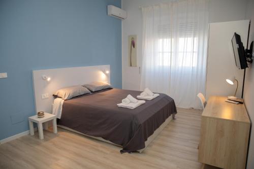 Postel nebo postele na pokoji v ubytování Deruchi apartments