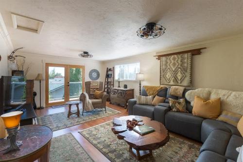 a living room with a couch and a table at Sq Wild Rose 2 in Sequim