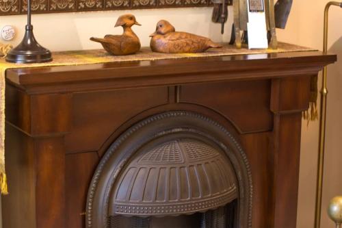 two ducks sitting on top of a fireplace at Sq Wild Rose 2 in Sequim