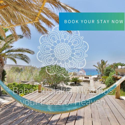a hammock on the beach with a mandala on it at Baba Houlakia in Houlakia