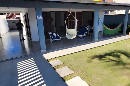 En terrasse eller udendørsområde på Aconchego Próximo ao Mar