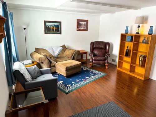 a living room with a couch and a chair at Perfect for West End Shopping in Billings