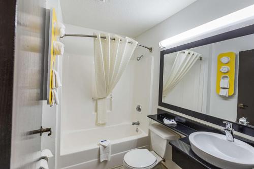 a bathroom with a sink and a toilet and a mirror at Motel 6-Simpsonville, SC - Greenville in Simpsonville