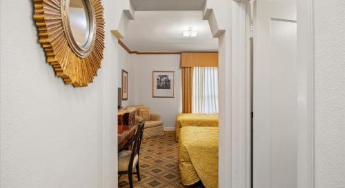 a room with a bed and a mirror on the wall at EMBASSY HOTEL in San Francisco