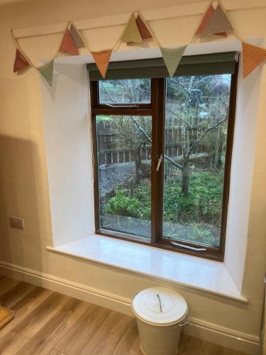 a window in a room with a toilet in front of it at NY Moors' peaceful retreat - Great Fryup, Lealholm in Fryup
