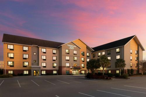 a rendering of a hotel with a parking lot at TownePlace Suites by Marriott Florence in Florence