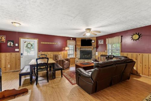 a living room with a couch and a table at Sundance Cabin in Stanton