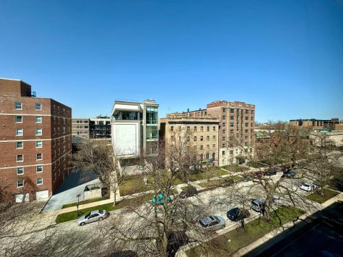 an aerial view of a city with buildings and cars at The GEM Museum Suites in Evanston