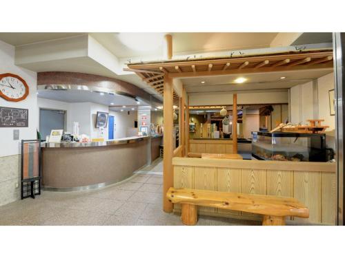 a restaurant with a bench in front of a counter at Kaifutei Teradomari Nihonkai - Vacation STAY 25854v in Nagaoka