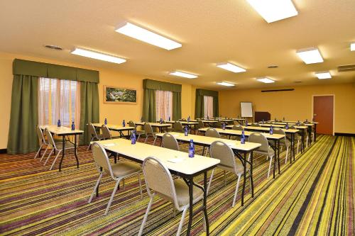 a conference room with tables and chairs in it at Fairfield Inn & Suites Cherokee in Cherokee