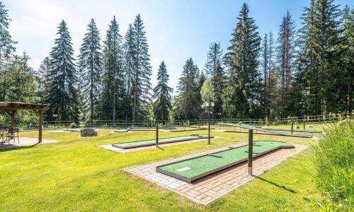 a golf course in a park with trees at Apartmán Stella, Vysoké Tatry in Tatranska Strba