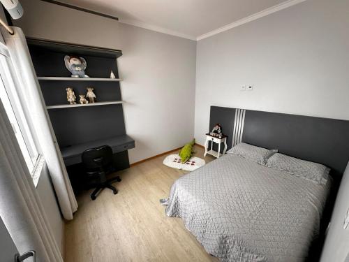Katil atau katil-katil dalam bilik di Casa em Toledo 1 suíte e 2 quartos confortável