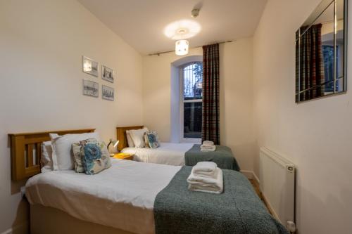 Ένα ή περισσότερα κρεβάτια σε δωμάτιο στο Noble Apartment - Highland Club