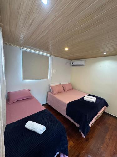 Postel nebo postele na pokoji v ubytování LOFT Completo - próximo ao Centro com Ar Condicionado