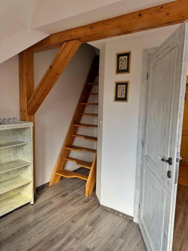 a room with a staircase and a door at Na Hřebenovce in Krompach