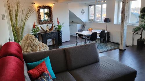 a living room with a couch and a table at Luxury Apt - View of the Center of Prague in Prague
