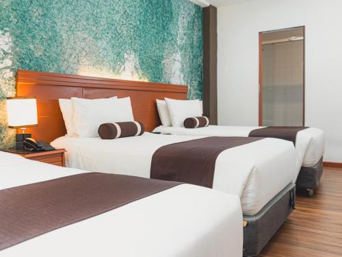 Postel nebo postele na pokoji v ubytování Hotel Ferré Machu Picchu