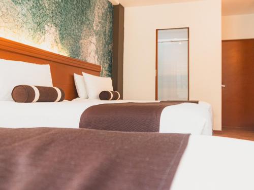 Postel nebo postele na pokoji v ubytování Hotel Ferré Machu Picchu
