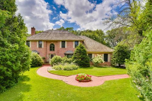 a brick house with a garden and a walkway at Spacious and Secluded Madison Home Near Dtwn! in Madison