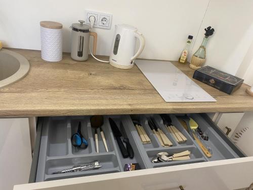a drawer in a counter with a tool kit at Golden Rush in Rīga