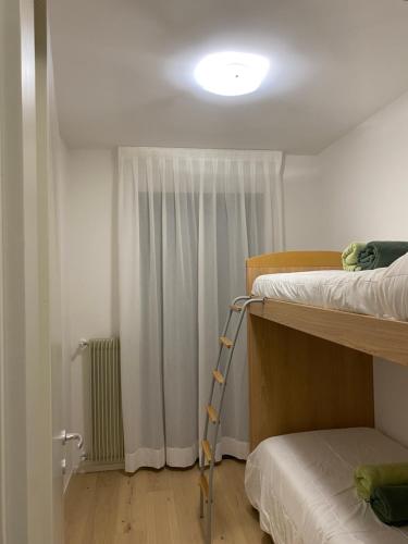 a room with two bunk beds and a light at Bollicine&Relax in Col San Martino