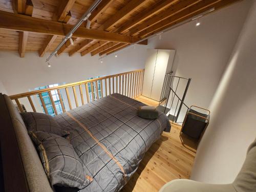 a bedroom with a bed and a balcony at Green Leaf - Old City Suite in Limassol