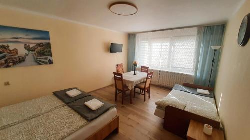 Ένα ή περισσότερα κρεβάτια σε δωμάτιο στο Apartament Sofia
