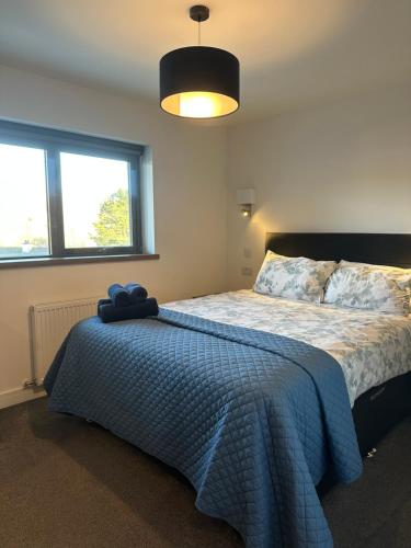 Katil atau katil-katil dalam bilik di Skyelander Apartments