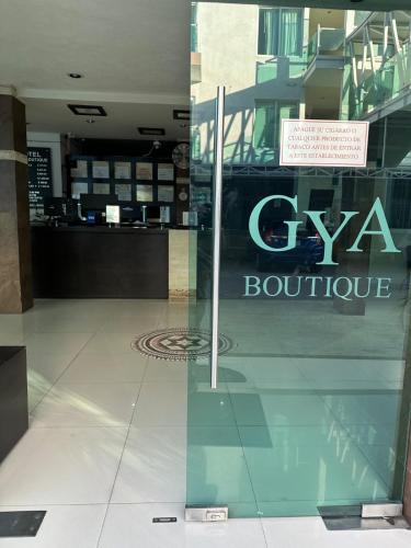 a sign in the window of a store at Hotel Gya Boutique in Aguascalientes