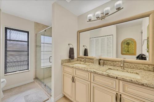 a bathroom with a sink and a mirror at LPC1140 in Punta Gorda