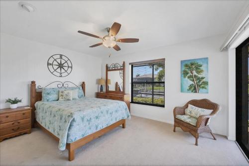 a bedroom with a bed and a ceiling fan at LPC1140 in Punta Gorda