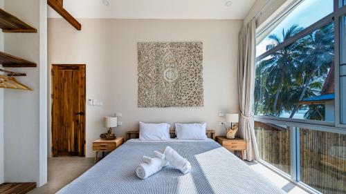 Katil atau katil-katil dalam bilik di Coastal Haven in Ban Tai 2BD Villa