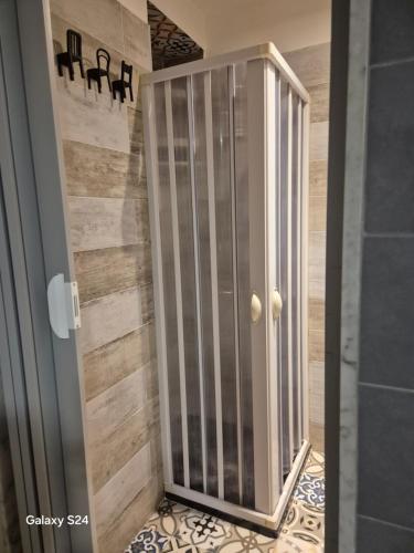 a shower in a bathroom with a glass door at Sweet Home Sofia in Barletta