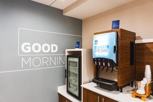 a coffee station in a store with a good morning sign at Holiday Inn Express Frazer - Malvern by IHG in Frazer