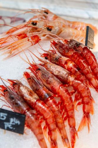 a bunch of shrimp on a table with a sign at Sheraton Grand Warsaw in Warsaw