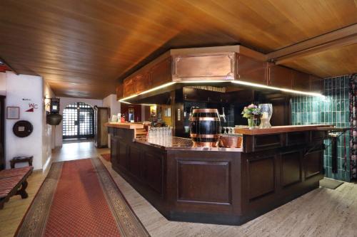 a kitchen with an island in a room at Brauereigasthof-Hotel Roter Ochsen in Ellwangen