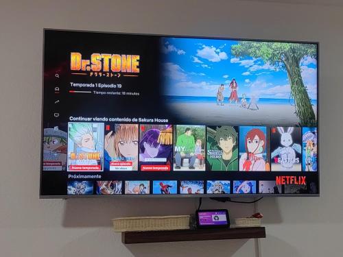 TV a/nebo společenská místnost v ubytování Sakura House
