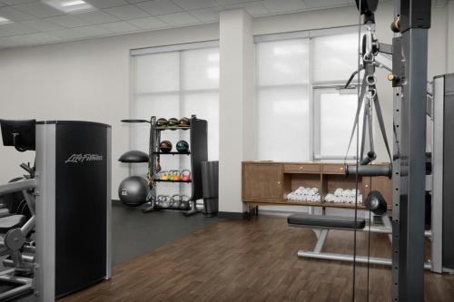 a room with a gym with a treadmill and weights at Springhill Suites by Marriott Savannah Downtown Historic District in Savannah