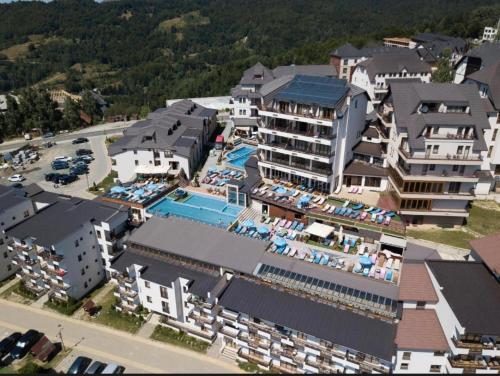 an aerial view of a resort with a swimming pool at Apartman TAUNUS in Kopaonik
