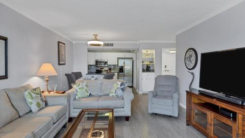 a living room with a couch and a flat screen tv at MA25188C-103 in New York