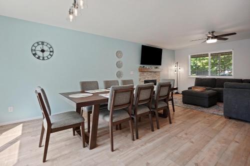 a dining room and living room with a table and chairs at Redmond Rest in Redmond