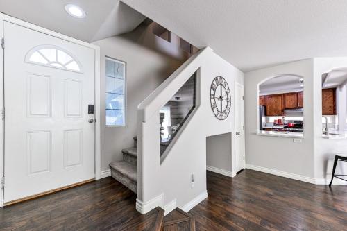 an empty living room with a white door and stairs at Vila Amor- Pool, Games and Ultimate Vegas Vibes in Las Vegas