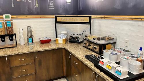 a kitchen with a counter top with food on it at Hampton Inn by Hilton Montrose in Montrose