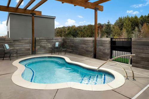 a swimming pool on the patio of a house at Fairfield by Marriott Inn & Suites Traverse City in Traverse City