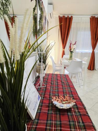 a living room with a table with a platter of food at Roma Centro Apartment Tor Vergata in Tor Vergata