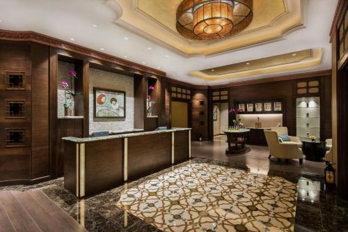 a lobby of a hotel with a reception desk at Londoner Grand, a Luxury Collection Hotel, Macau in Macau