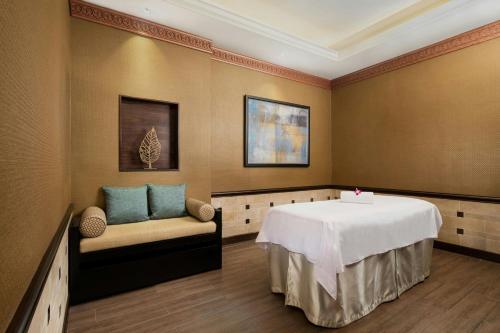 a hospital room with a table and a chair at Londoner Grand, a Luxury Collection Hotel, Macau in Macau